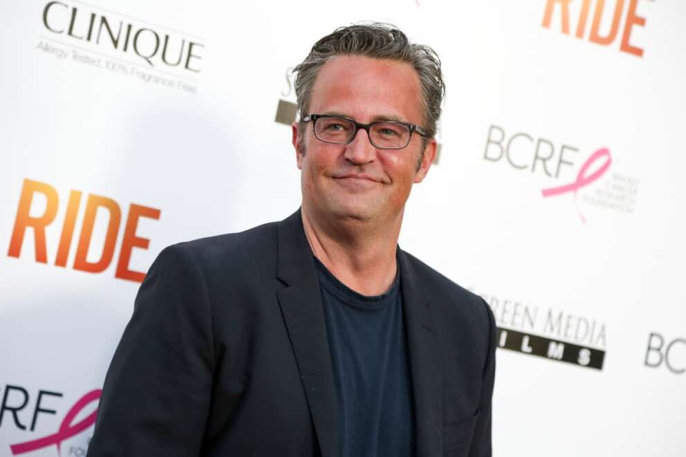 FILE – Matthew Perry arrives at the premiere of “Ride” at The Arclight Hollywood Theater in Los Angeles. Perry, who starred as Chandler Bing in the hit series “Friends,” has died. He was 54. The Emmy-nominated actor was found dead of an apparent drowning at his Los Angeles home on Saturday, according to the Los Angeles Times and celebrity website TMZ, which was the first to report the news. Both outlets cited unnamed sources confirming Perry’s death. His publicists and other representatives did not immediately return messages seeking comment. (Photo by Rich Fury/Invision/AP, File)