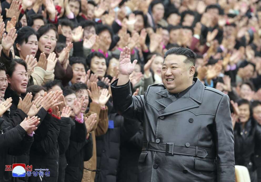 This photo provided on Dec. 9, 2023, by the North Korean government, North Korean leader Kim Jong Un waves to the participants of the National Mothers’ Meeting in Pyongyang, North Korea on Dec. 8, 2023. Independent journalists were not given access to cover the event depicted in this image distributed by the North Korean government. The content of this image is as provided and cannot be independently verified. Korean language watermark on image as provided by source reads: “KCNA” which is the abbreviation for Korean Central News Agency. (Korean Central News Agency/Korea News Service via AP)