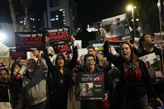 Friends and relatives of the Israeli hostages held in the Gaza Strip by the Hamas militant group attend a rally calling for their release, Saturday, Dec. 9, 2023, in Tel Aviv, Israel. (AP Photo/Ohad Zwigenberg)