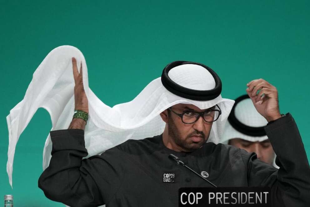 COP28 President Sultan al-Jaber adjust his ghutra during a plenary stocktaking session at the COP28 U.N. Climate Summit, Monday, Dec. 11, 2023, in Dubai, United Arab Emirates. (AP Photo/Rafiq Maqbool)