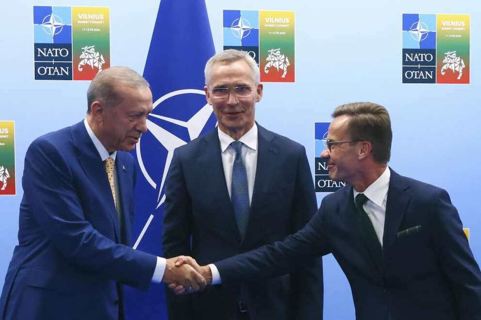 FILE – Turkey’s President Recep Tayyip Erdogan, left, shakes hands with Sweden’s Prime Minister Ulf Kristersson, right, as NATO Secretary General Jens Stoltenberg looks on prior to a meeting ahead of a NATO summit in Vilnius, Lithuania, Monday, July 10, 2023. The Turkish parliament’s foreign affairs committee was poised on Tuesday, Dec. 26, 2023, to resume deliberations on Sweden’s bid to join NATO, days after President Recep Tayyip Erdogan linked the Nordic country’s admission on U.S. approval of Turkey’s request to purchase F-16 fighter jets.(Yves Herman, Pool Photo via AP, File)