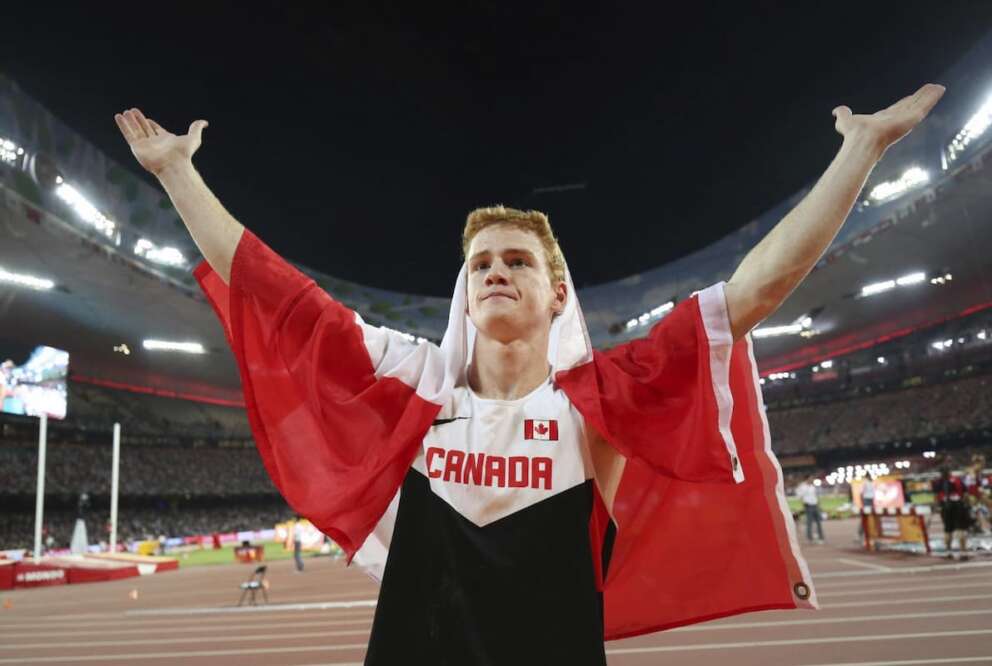 FILE – Canada’s Shawn Barber celebrates after winning the gold medal in the men’s pole vault final at the World Athletics Championships at the Bird’s Nest stadium in Beijing, Monday, Aug. 24, 2015. Barber has died from medical complications. He was 29. Barber died Wednesday, Jan. 17, 2024, at home in Kingwood, Texas, his agent, Paul Doyle, confirmed to The Associated Press.(Christian Charisius/dpa via AP, File)