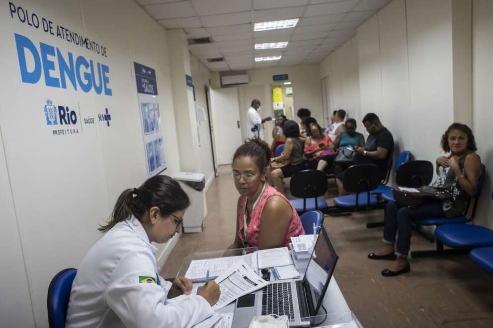 Ana Paula Duarte is attended by a nurse at the dengue screening area of the Rodolpho Rocco Municipal Polyclinic in Rio de Janeiro, Brazil, Wednesday, Feb. 7, 2024. (AP Photo/Bruna Prado)