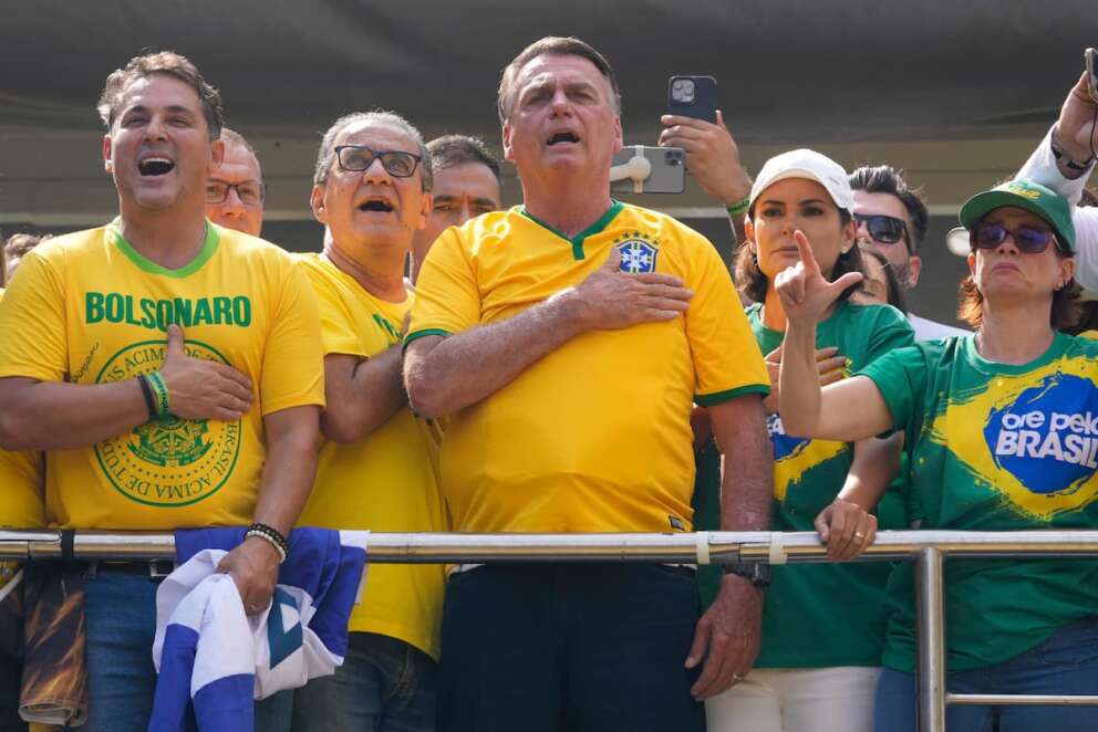 Former President Jair Bolsonaro, center, addresses supporters during a rally in Sao Paulo., Brazil, Sunday, Feb. 25, 2024. Bolsonaro and some of his former top aides are under investigation into allegations they attempted plotted a coup to remove his successor, Luis Inacio Lula da Silva. (AP Photo/Andre Penner) Associated Press / LaPresse Only italy and Spain