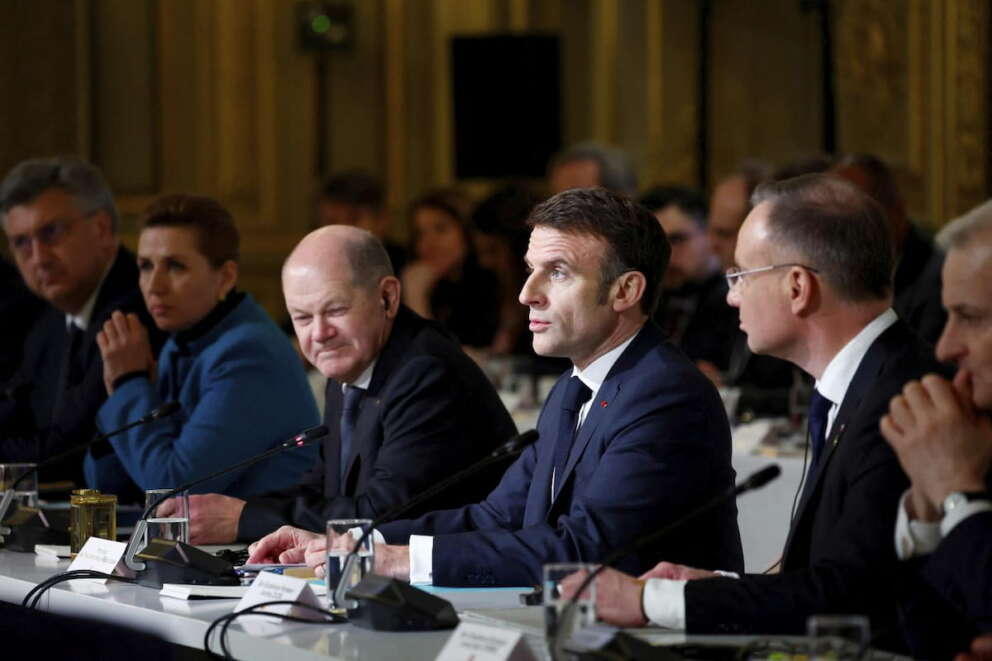 French President Emmanuel Macron, center, delivers a speech at the Elysee Palace in Paris, Monday, Feb. 26, 2024. More than 20 European heads of state and government and other Western officials are gathering in a show of unity for Ukraine, signaling to Russia that their support for Kyiv isn\’t wavering as the full-scale invasion grinds into a third year. (Gonzalo Fuentes/Pool via AP)