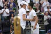 Italy’s Jannik Sinner hugs Spain’s Carlos Alcaraz after defeating him a men’s fourth round singles match on day seven of the Wimbledon tennis championships in London, Sunday, July 3, 2022.(AP Photo/Kirsty Wigglesworth)