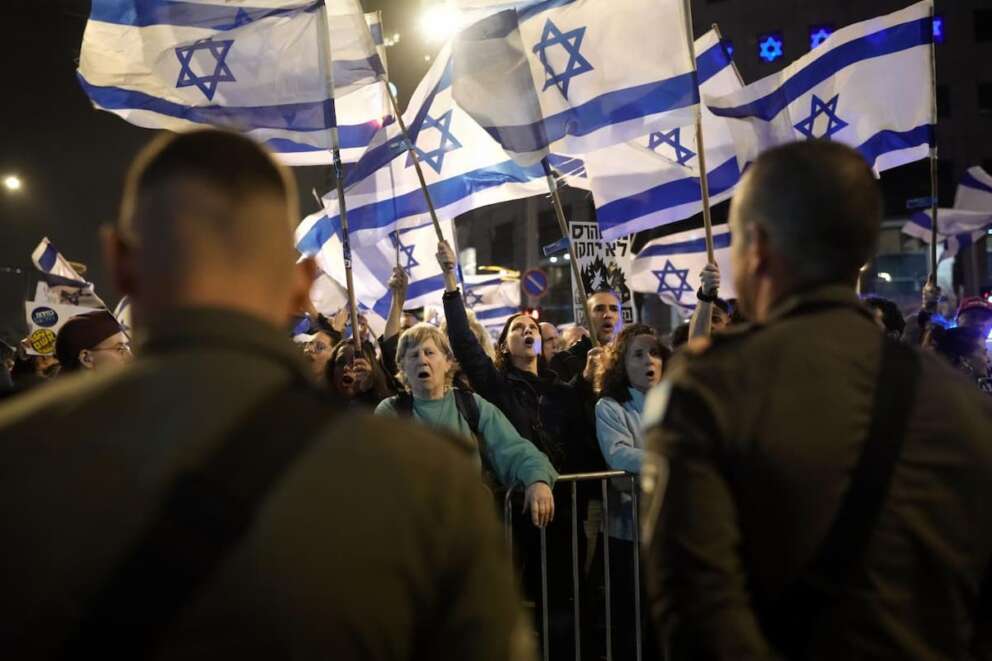 People protest against Israeli Prime Minister Benjamin Netanyahu’s government in Tel Aviv, Israel, Saturday, March 2, 2024. (AP Photo/Leo Correa)