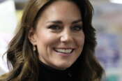 FILE – Kate, Princess of Wales smiles as she speaks to a woman during her visit to Sebby\’s Corner in north London on Nov. 24, 2023. Charles\’ illness comes at a awkward time, as his daughter in law, the Princess of Wales, has also had her own health issues, having recently been hospitalized for two weeks following abdominal surgery following at the private London clinic. The former Kate Middleton won\’t be returning to public duties until after Easter and that will prompt other members of the royal family to pick up the slack. (AP Photo/Frank Augstein, Pool)