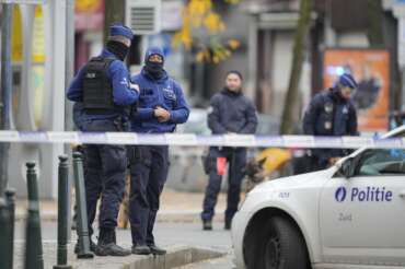 Belgian Police stand behind a cordoned off area close to where a suspected Tunisian extremist has been shot dead hours after manhunt looking for him Tuesday, Oct. 17, 2023. Police in Belgium have shot dead a suspected Tunisian extremist accused of killing two Swedish soccer fans in a brazen attack on a Brussels street before disappearing into the night on Monday. (AP Photo/Martin Meissner) Associated Press/LaPresse Only Italy and Spain