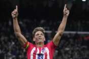 Atletico Madrid’s Marcos Llorente celebrates after scoring his side’s first goal during the Spanish La Liga soccer match between Real Madrid and Atletico Madrid at the Santiago Bernabeu stadium in Madrid, Spain, Sunday, Feb. 4, 2024. (AP Photo/Bernat Armangue)