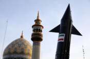 A model of a missile is carried by Iranian demonstrators as a minaret and dome of a mosque is seen at background during an anti-Israeli gathering at the Felestin (Palestine) Sq. in Tehran, Iran, Monday, April 15, 2024. World leaders are urging Israel not to retaliate after Iran launched an attack involving hundreds of drones, ballistic missiles and cruise missiles. (AP Photo/Vahid Salemi) Associated Press / LaPresse Only italy and spain