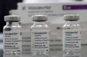 FILE – Vaxzevria COVID-19 vaccine, previously COVID-19 Vaccine AstraZeneca, are pictured at the Assad Iben El Fourat school in Oued Ellil, outside Tunis, on Aug.8, 2021. British-Swedish pharmaceutical company AstraZeneca said Friday that it will start to book a modest profit from its coronavirus vaccine as it moves away from the nonprofit model that it has operated so far during the pandemic. Through the pandemic so far, AstraZeneca said it would provide the vaccine, which was developed by scientists at the University of Oxford, “at cost.” It confirmed Friday that it will not be booking any coronavirus vaccine profits from developing countries. (AP Photo/Hassene Dridi)
