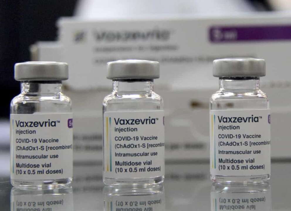 FILE – Vaxzevria COVID-19 vaccine, previously COVID-19 Vaccine AstraZeneca, are pictured at the Assad Iben El Fourat school in Oued Ellil, outside Tunis, on Aug.8, 2021. British-Swedish pharmaceutical company AstraZeneca said Friday that it will start to book a modest profit from its coronavirus vaccine as it moves away from the nonprofit model that it has operated so far during the pandemic. Through the pandemic so far, AstraZeneca said it would provide the vaccine, which was developed by scientists at the University of Oxford, “at cost.” It confirmed Friday that it will not be booking any coronavirus vaccine profits from developing countries. (AP Photo/Hassene Dridi)