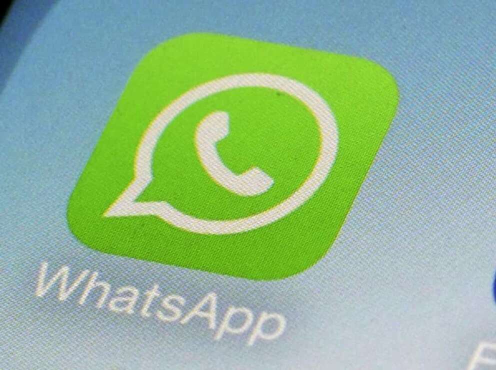 FILE – This Feb. 19, 2014, file photo, shows WhatsApp app icon on a smartphone in New York. WhatsApp parent Meta is moving forward with its push to attract businesses to its popular chat app. Its part of an effort to find new ways to make money beyond targeted advertisements on its other platforms, Facebook and Instagram. (AP Photo/Patrick Sison, File)