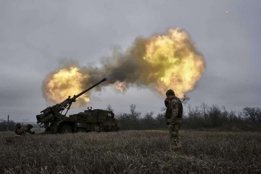 FILE – Ukrainian soldiers fire a French-made CAESAR self-propelled howitzer towards Russian positions near Avdiivka, Donetsk region, Ukraine, Monday, Dec. 26, 2022. French manufacturers have halved or better the manufacturing times for some of the weapons systems they are supplying to Ukraine, as France increasingly switches away from its previous policy of dipping into its own military stocks to furnish the war effort against Russia, the French defense minister said in an interview published Thursday Jan.18, 2024. . (AP Photo/Libkos, FILE)