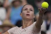 Camila Giorgi, of Italy, serves to Katie Boulter, of Britain, during their match at the BNP Paribas Open tennis tournament Wednesday, March 6, 2024, in Indian Wells, Calif. (AP Photo/Mark J. Terrill)