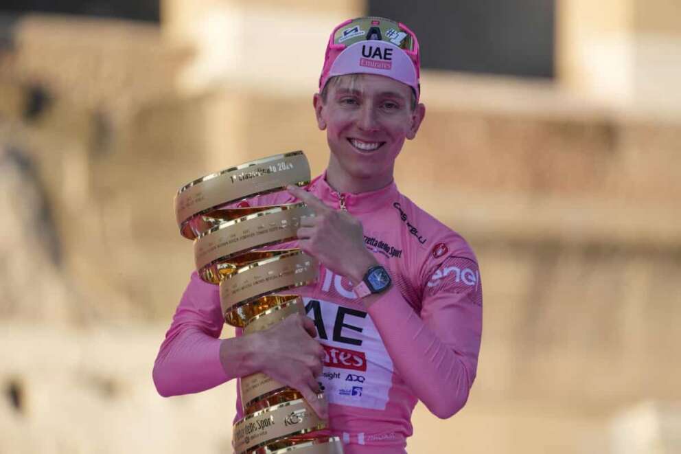 Tour of Italy winner Slovenia’s Tadej Pogacar holds the trophy during the podium ceremony at the end of the 21st and last stage of the Giro D’Italia, cycling race, in Rome, Sunday, May 26, 2024. (AP Photo/Andrew Medichini) Associated Press/LaPresse