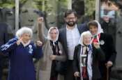 Chile’s President Gabriel Boric poses for a picture with Angela “Lita” Boitano, president of Human Rights organization “Families of the Disappeared and Detained,” left, and members of the Mothers of Plaza de Mayo Buscarita Roa, second from left, Nora Cortinas, second from right, and Tati Almeida at the Space for Memory and for the Promotion and Defense of Human Rights museum in Buenos Aires, Argentina, Tuesday, April 5, 2022. Boric visited the former Argentine Navy School of Mechanics where torture took place during the country’s 1976-1983 military dictatorship, which was turned into this museum. (AP Photo/Natacha Pisarenko)