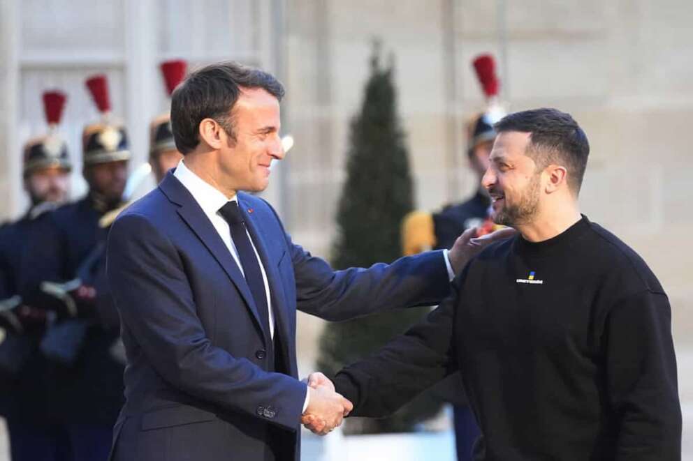 FILE – French President Emmanuel Macron, right, welcomes Ukrainian President Volodymyr Zelenskyy at the Elysee palace in Paris, Sunday, May 14, 2023. European leaders promised Zelenskyy missiles, tanks and drones during a whirlwind three-day visit to Italy, Germany, France and the U.K. that sought to replenish Ukraine’s depleted weapons supplies ahead of a spring offensive aimed at turning the tide of the war. (AP Photo/Michel Euler, File)