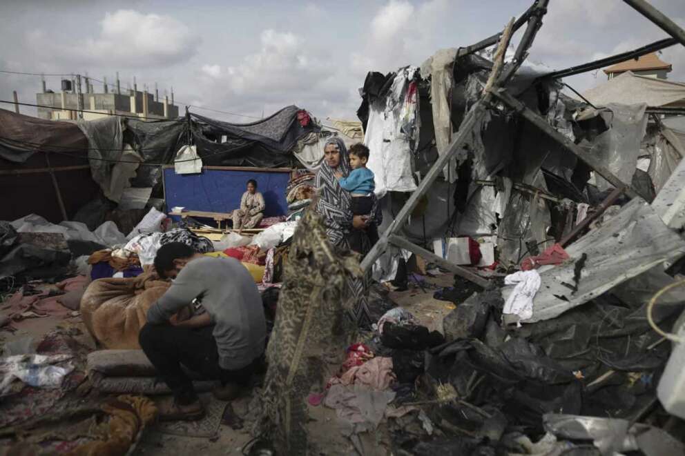 Displaced Palestinians inspect their tents destroyed by Israel’s bombardment, adjunct to an UNRWA facility west of Rafah city, Gaza Strip, Tuesday, May 28, 2024. (AP Photo/Jehad Alshrafi)