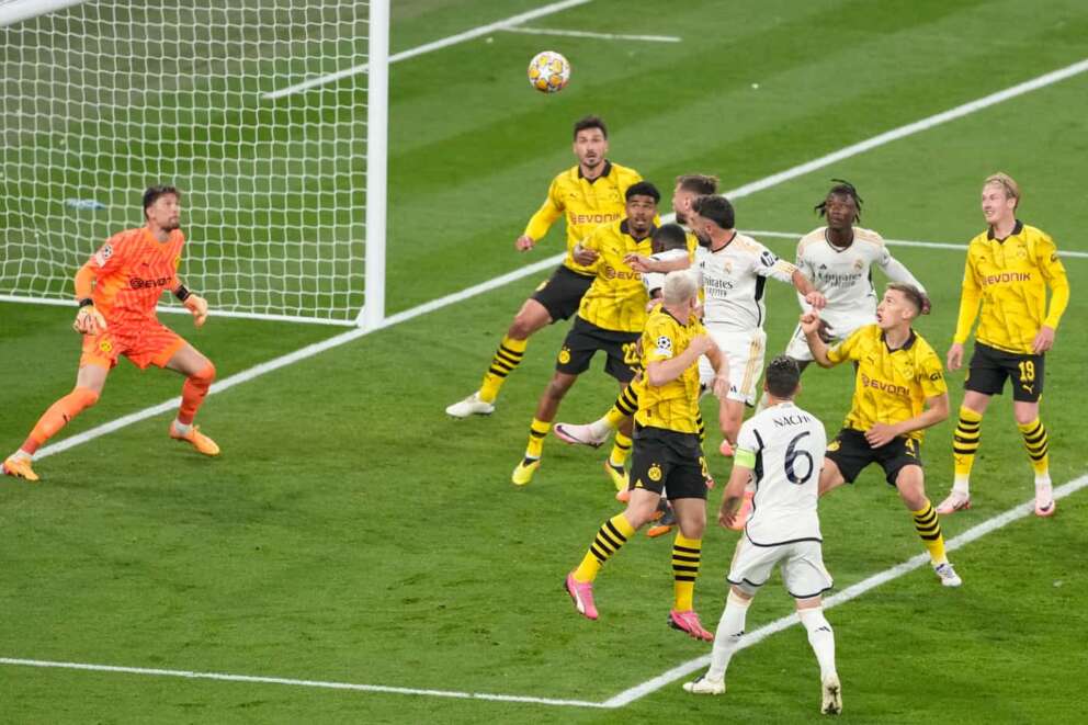 Real Madrid’s Dani Carvajal, center, scores his side’s opening goal during the Champions League final soccer match between Borussia Dortmund and Real Madrid at Wembley stadium in London, Saturday, June 1, 2024. (AP Photo/Alastair Grant)