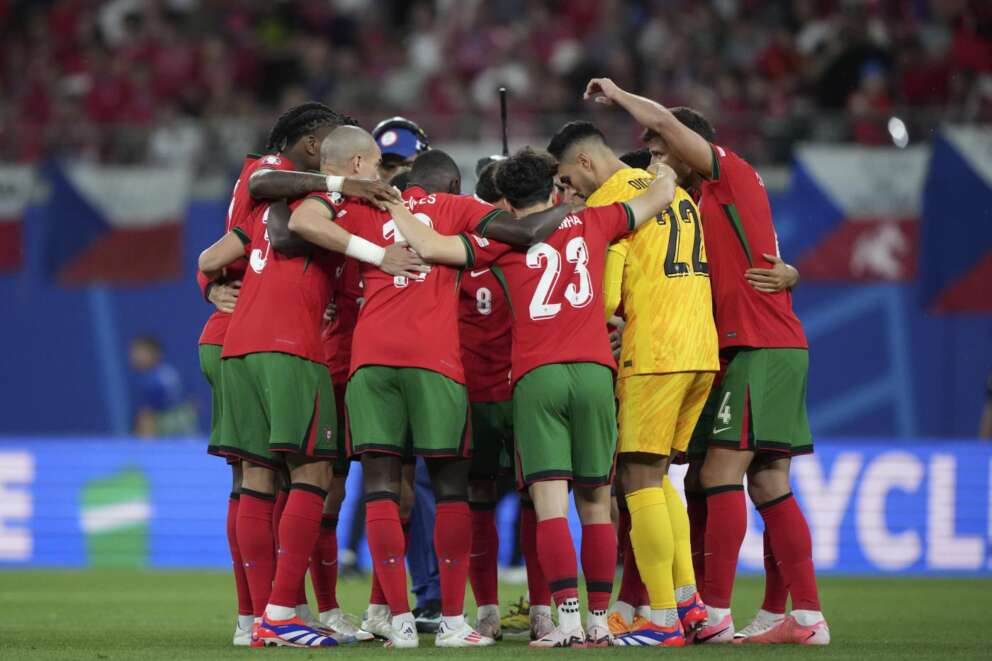 Portugal’s players huddling together in a circle before a Group F match between Portugal and Czech Republic at the Euro 2024 soccer tournament in Leipzig, Germany, Tuesday, June 18, 2024. (AP Photo/Ebrahim Noroozi)