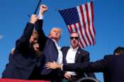 Republican presidential candidate former President Donald Trump is surrounded by U.S. Secret Service agents at a campaign rally, Saturday, July 13, 2024, in Butler, Pa. (AP Photo/Evan Vucci) Associated Press / LaPresse Only italy and Spain