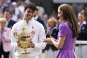 Carlos Alcaraz of Spain reacts after receiving his trophy from Kate, Princess of Wales after defeating Novak Djokovic of Serbia in the men’s singles final at the Wimbledon tennis championships in London, Sunday, July 14, 2024. (AP Photo/Alberto Pezzali)