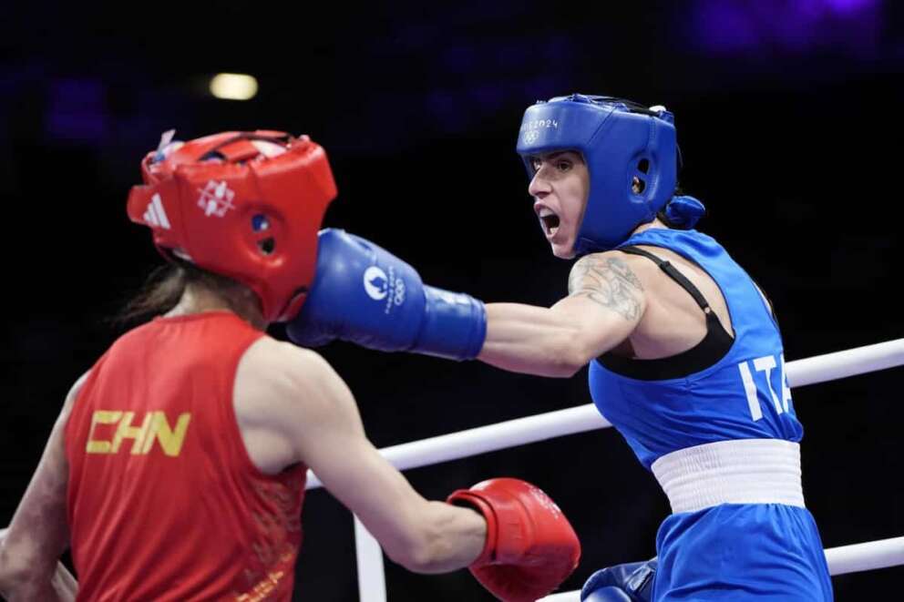 China’s Xu Zichun, left, fights Italy’s Irma Testa in their preliminary women’s 57kg boxing match at the 2024 Summer Olympics, Tuesday, July 30, 2024, in Paris, France. (AP Photo/John Locher)