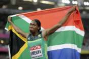 FILE – In this Sunday, Aug. 13, 2017 file photo South Africa’s Caster Semenya celebrates winning the gold in the final of the Women’s 800m during the World Athletics Championships in London. Forced out of her favorite race by World Athletics’ testosterone rules, the two-time Olympic champion in the 800 meters took a late punt at qualifying for Tokyo in the 5,000 meters. She came up short. Now 30, Semenya’s hopes of ever making it back to the Olympics are dwindling. (AP Photo/David J. Phillip, File)