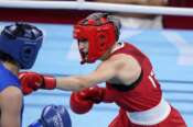 Italy’s Angela Carini, right, punches Nien-Chin Chen, of Chinese Taipei, and during their welter weight (69kg) preliminary boxing match at the 2020 Summer Olympics, Tuesday, July 27, 2021, in Tokyo, Japan. (AP Photo/ Frank Franklin II)