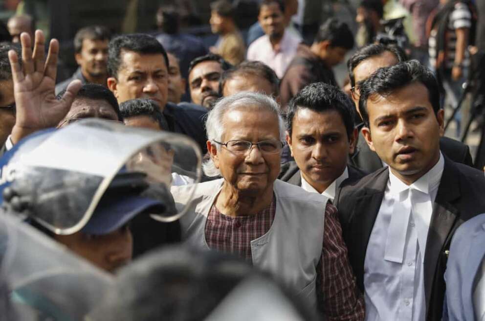 Nobel Peace Prize winner Muhammad Yunus, center, arrives to appear before a labor court in Dhaka, Bangladesh, Monday, Jan.1. 2024. (AP Photo/ Mahmud Hossain Opu)