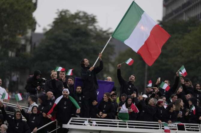 Italian olimpic team in Paris, France, during the opening ceremony of the 2024 Summer Olympics, Friday, July 26, 2024. (AP Photo/Luca Bruno)