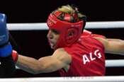 FILE – Imane Khelif, of Algeria, right, delivers a punch to Mariem Homrani Ep Zayani, of Turkey, during their women’s light weight 60kg preliminary boxing match at the 2020 Summer Olympics, Friday, July 30, 2021, in Tokyo, Japan. (AP Photo/Themba Hadebe, File)