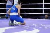 Italy’s Angela Carini reacts after she was defeating by Algeria’s Imane Khelif, in their women’s 66kg preliminary boxing match at the 2024 Summer Olympics, Thursday, Aug. 1, 2024, in Paris, France. (AP Photo/John Locher)