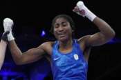 Refugee Olympic Team’s Cindy Ngamba celebrates after defeating Canada’s Tammara Thibeault in their women’s 75 kg preliminary boxing match at the 2024 Summer Olympics, Wednesday, July 31, 2024, in Paris, France. (AP Photo/Ariana Cubillos)