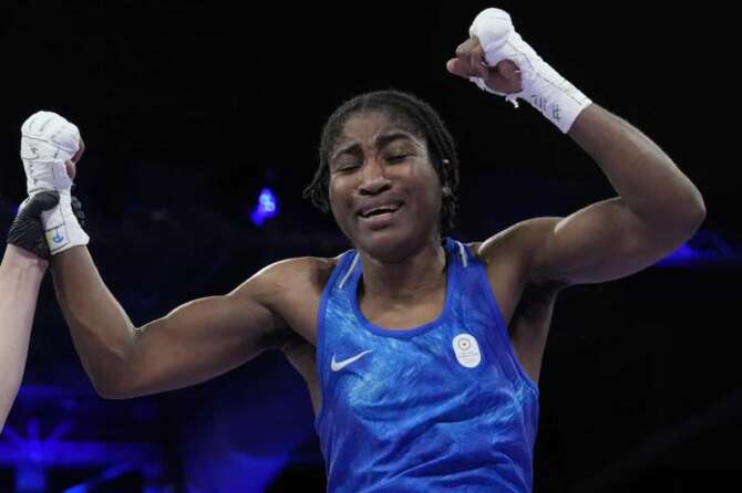 Refugee Olympic Team’s Cindy Ngamba celebrates after defeating Canada’s Tammara Thibeault in their women’s 75 kg preliminary boxing match at the 2024 Summer Olympics, Wednesday, July 31, 2024, in Paris, France. (AP Photo/Ariana Cubillos)