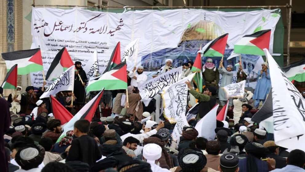 Afghan people attend a demonstration to condemn the killing of Hamas leader Ismail Haniyeh, who was killed in Tehran, and to show solidarity with Palestinian people living in Gaza, in Herat province, western Afghanistan, Wednesday, Aug. 7, 2024. (AP Photo/Omid Haqjoo)