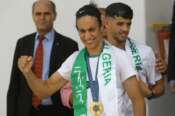 Gold medalist in the the women’s 66 kg boxing Algeria’s Imane Khelif, left, and bronze medalist in the men’s 800m Djamel Sedjati arrive after the 2024 Summer Olympics, Monday, Aug. 12, 2024, at Algiers airport, Algeria. (AP Photo/Anis Belghoul)