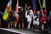 Athletes from different delegations parade during the closing ceremony of the 2024 Paralympics, Sunday, Sept. 8, 2024, in Paris, France. (AP Photo/Michel Euler)