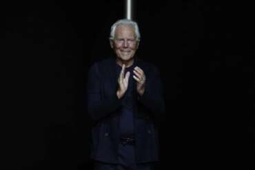 Designer Giorgio Armani accepts applause at the end of the Emporio Armani men’s Spring Summer 2024 collection presented in Milan, Italy, Saturday, June 17, 2023. (AP Photo/Luca Bruno)