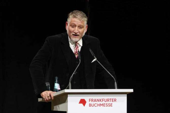 Italian Minister of Culture, Alessandro Giuli, delivers a speech during the opening ceremony of the Frankfurter Buchmesse (Book Fair) in Frankfurt, Germany, Tuesday, Oct. 15, 2024. (Andreas Arnold/dpa via AP)