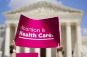 Demonstrators hold signs as they rally outside the Supreme Court building during the Women’s March in Washington, Saturday, June 24, 2023. Abortion rights and anti-abortion activists held rallies Saturday in Washington and across the country to call attention to the Dobbs v. Jackson Women’s Health Organization ruling on June 24, 2022, which upended the 1973 Roe v. Wade decision. (AP Photo/Stephanie Scarbrough) Associated Press/LaPresse Only Italy and Spain