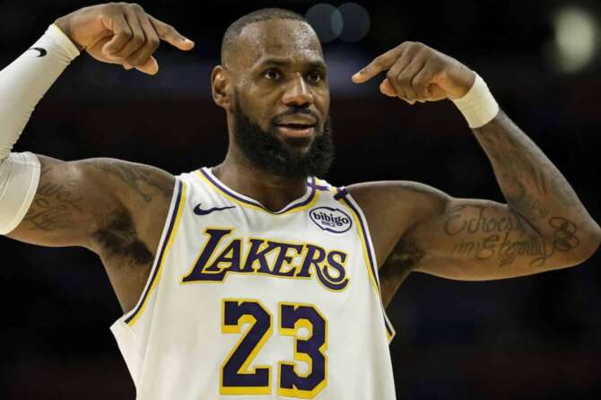 Los Angeles Lakers forward LeBron James (23) reacts after making a 3-point shot during the first half of an NBA basketball game against the Sacramento Kings, Saturday, Oct. 26, 2024, in Los Angeles. (AP Photo/William Liang)