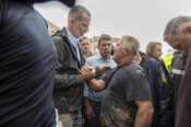 Spain’s King Felipe VI speaks with people amidst angry Spanish flood survivors in Paiporta, near Valencia, Spain, Sunday Nov. 3, 2024. (AP Photo/David Melero)