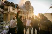 Residents shout slogans at the site of an Israeli airstrike in Dahiyeh, Beirut, Lebanon, Saturday, Nov. 9, 2024. (AP Photo/Hassan Ammar)