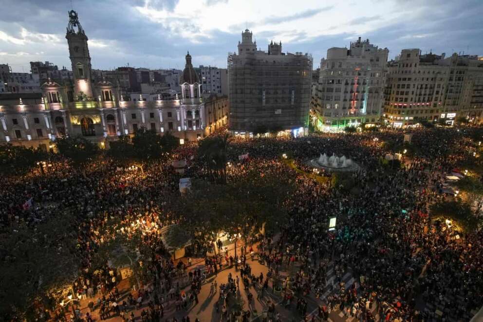 Thousands of demonstrators gather infant of the city council for a protest organized by social and civic groups, denouncing the handling of recent flooding under the slogan “Mazón, Resign,” aimed at the president of the regional government Carlos Mazon, in Valencia, Spain, Saturday, Nov. 9, 2024. (AP Photo/Emilio Morenatti)