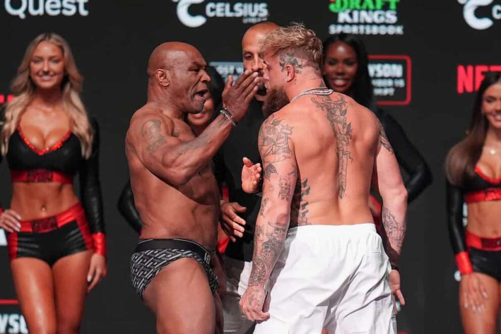 Mike Tyson, left, slaps Jake Paul during a weigh-in ahead of their heavyweight bout, Thursday, Nov. 14, 2024, in Irving, Texas. (AP Photo/Julio Cortez) Associated Press / LaPresse Only italy and Spain