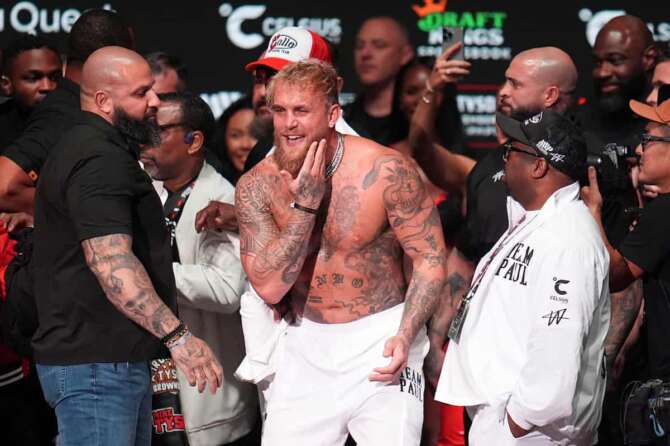 Jake Paul reacts after being slapped by Mike Tyson during a weigh-in ahead of their heavyweight bout, Thursday, Nov. 14, 2024, in Irving, Texas. (AP Photo/Julio Cortez) Associated Press / LaPresse Only italy and Spain