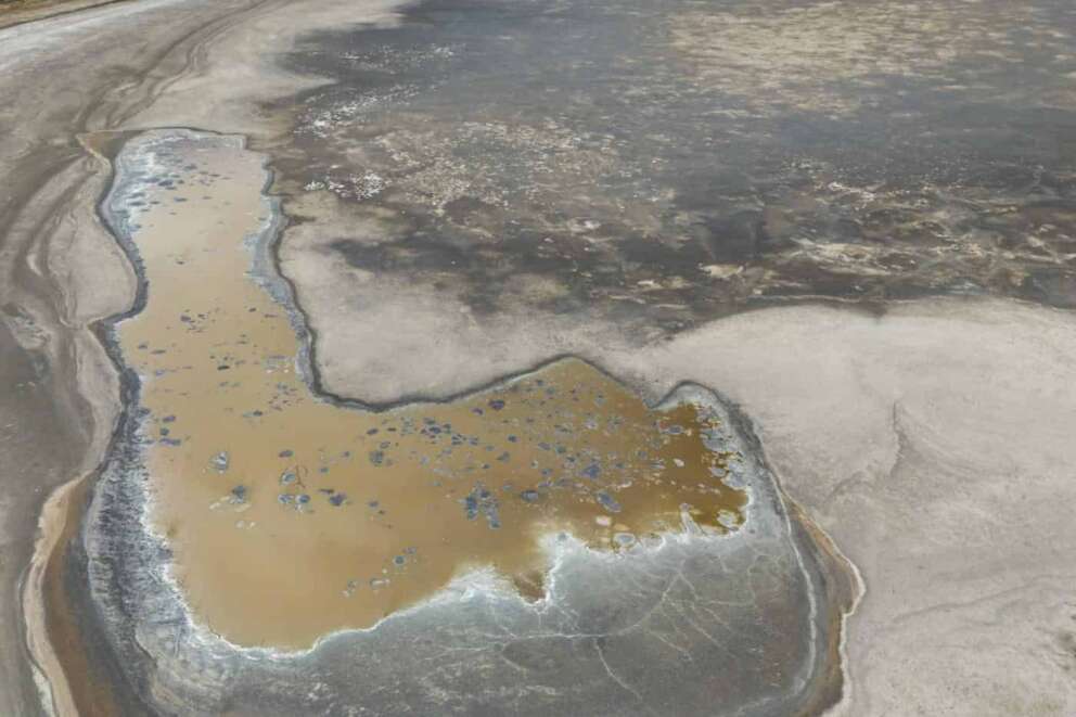 A view of the almost dry lake Pergusa, near Caltanissetta, central Sicily, Italy, that once served as a water reserve for large part of central Sicily, Friday, July 19, 2024. (AP Photo/Andrew Medichini) Associated Press/LaPresse